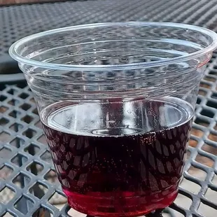 a glass of wine on a table
