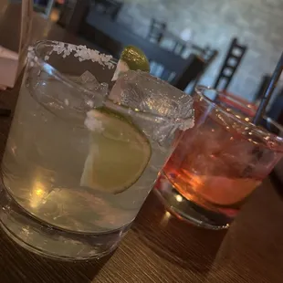 a close up of two glasses of alcohol