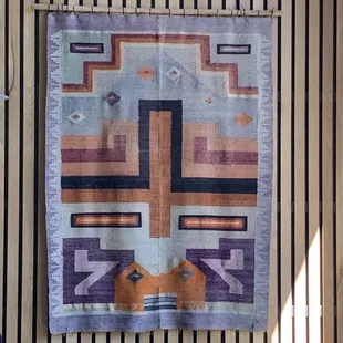 Beautiful woven rug next to the inside seating area.