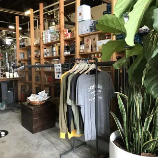 Clothes for sale at Red Bay Coffee Public Roastery in Oakland.
