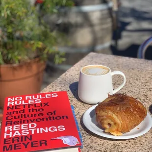 a croissant and a book