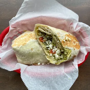 The Greek Breakfast Burrito

eggs, feta cheese, cherry tomato, shredded potatoes, &amp; pesto