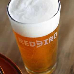 a glass of beer on a table