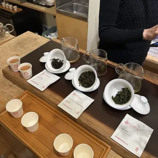 a woman in a kitchen preparing tea
