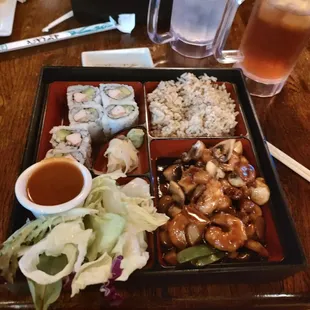 Bento Box: cashew shrimp, ginger salad, California roll, and brown rice