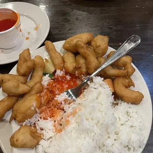 Sweet and Sour Chicken, white rice, and sauce on the side.