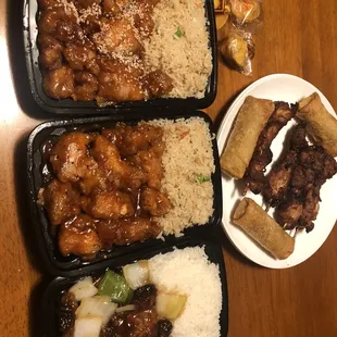 Combination platter: left to right - sesame chicken, general tso, bourbon chicken. Top - chicken on a stick