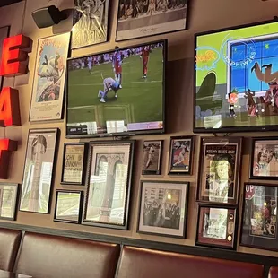 a wall full of sports memorabilia