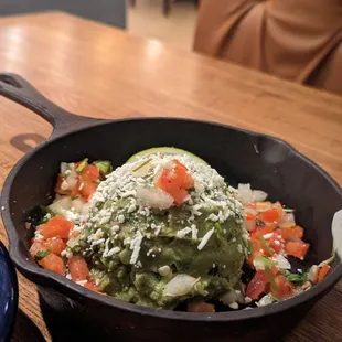 a skillet of food on a table