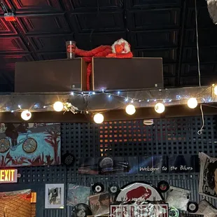 a bar with a ceiling full of signs