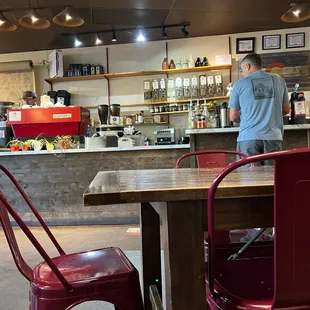 a man standing in a coffee shop