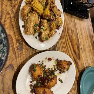 two plates of food on a wooden table