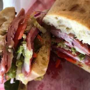Muffy's Muffaletta - Black Forest Ham, Salami, provolone, mozzarella, Italian giardiniera, lettuce, tomato, onion...and mayo.