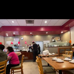 people sitting at a table in a restaurant