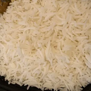 Rice in takeout Thali plate -- generous portion and fragrant.