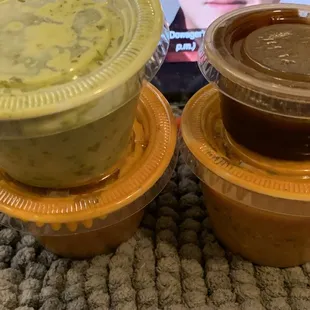 Condiments to accompany the Thali plate (cilantro chutney and tamarind above) and the momo (curry below).