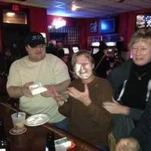 a group of people eating cake