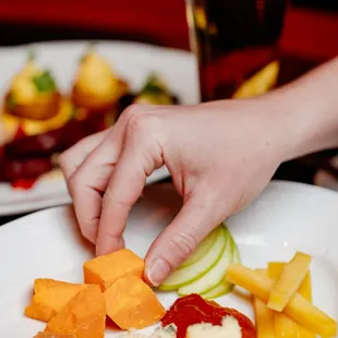 a plate of food with crackers and fruit