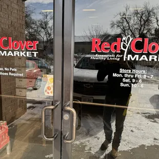 a man standing in front of a store