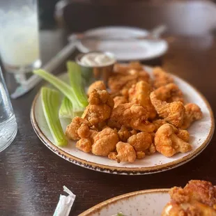 two plates of fried food