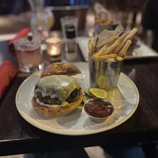 a burger and fries on a plate