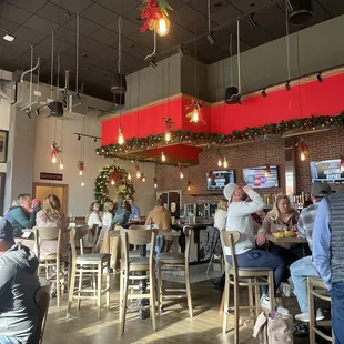 people sitting at tables in a restaurant