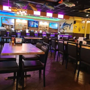 a restaurant with tables and chairs