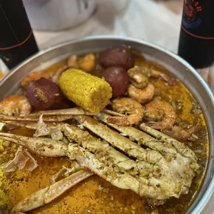 a bowl of seafood and corn