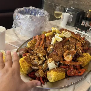 Crawfish, crab legs, shrimp, sausage, clams, corn, potatoes...