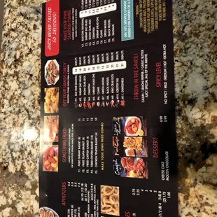 a menu on a granite counter top
