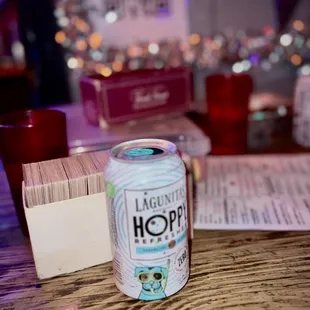 a can of beer on a table