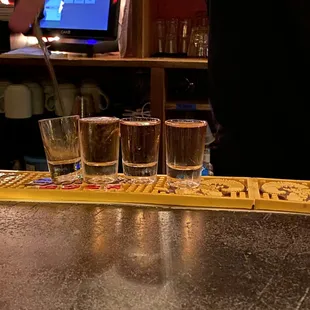 a bartender pouring a drink at a bar