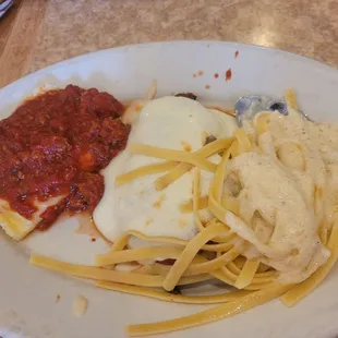 The "Trio" plate with chicken parmesan, ravioli and fettuccine alfredo.