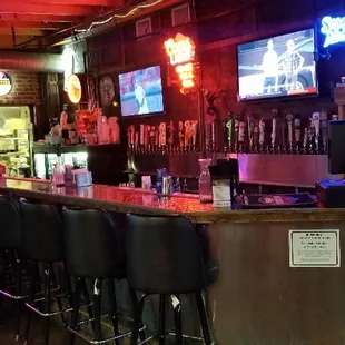 a bar with neon signs