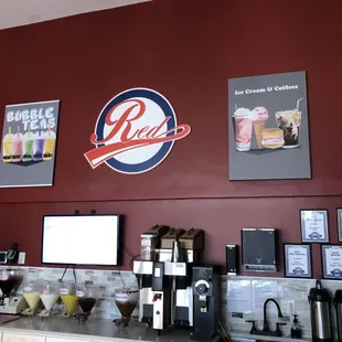 a coffee shop with a red wall