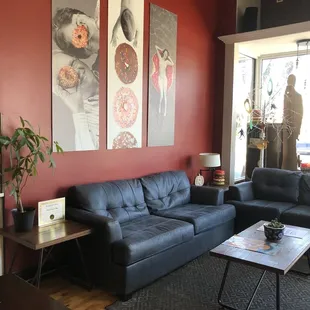 a black leather couch and a coffee table