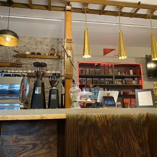 a bar with a counter and shelves