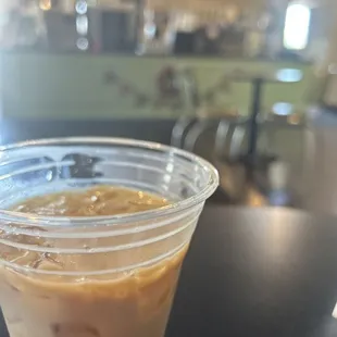 a plastic cup of iced coffee