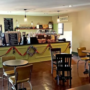 a man standing in a coffee shop