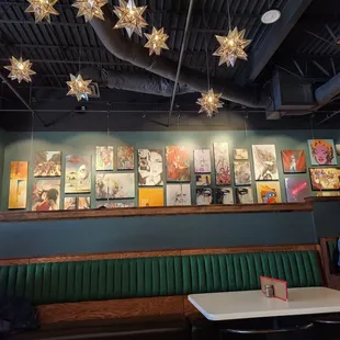 a green booth with a white table