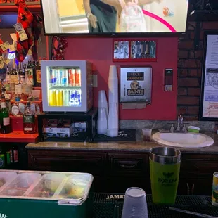 a woman in a green shirt on a television screen