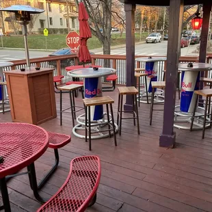 outside seating area with tables and umbrellas