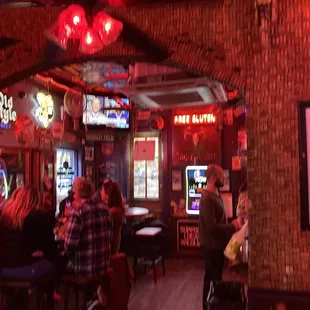 a group of people sitting at a bar