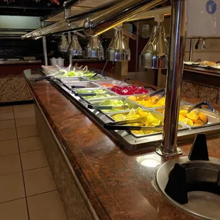 a variety of food in a buffet