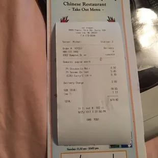 Menu with receipt taped to it