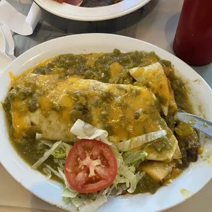 Burrito with queso and green sauce