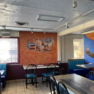a dining area with blue booths