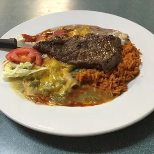 Steak, beans, rice, enchiladas