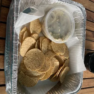 shows a tray of chips and a drink