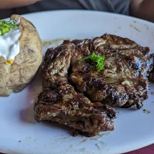 Ribeye with loaded baked potatoes